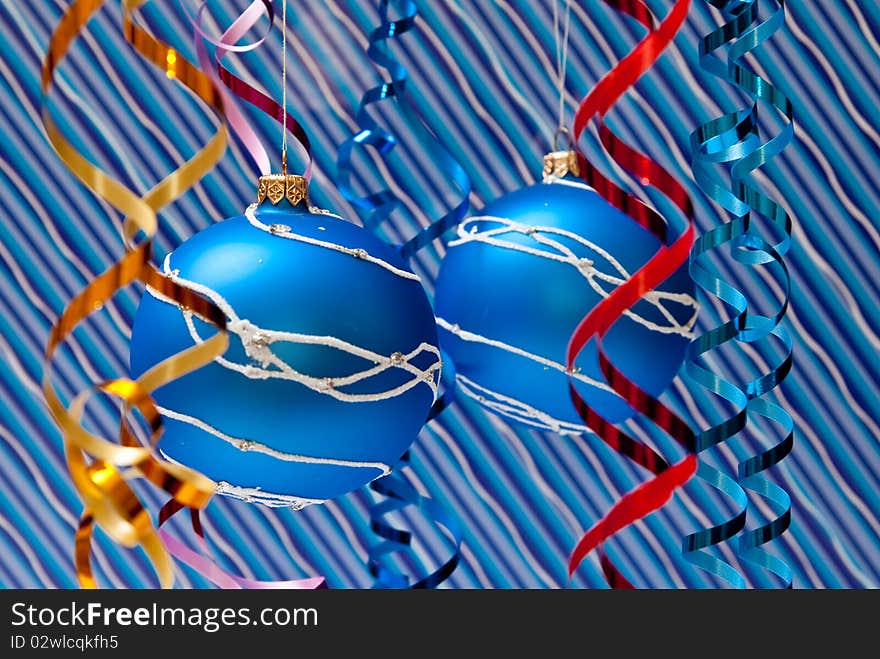 Christmas decoration from two blue balls on blue background