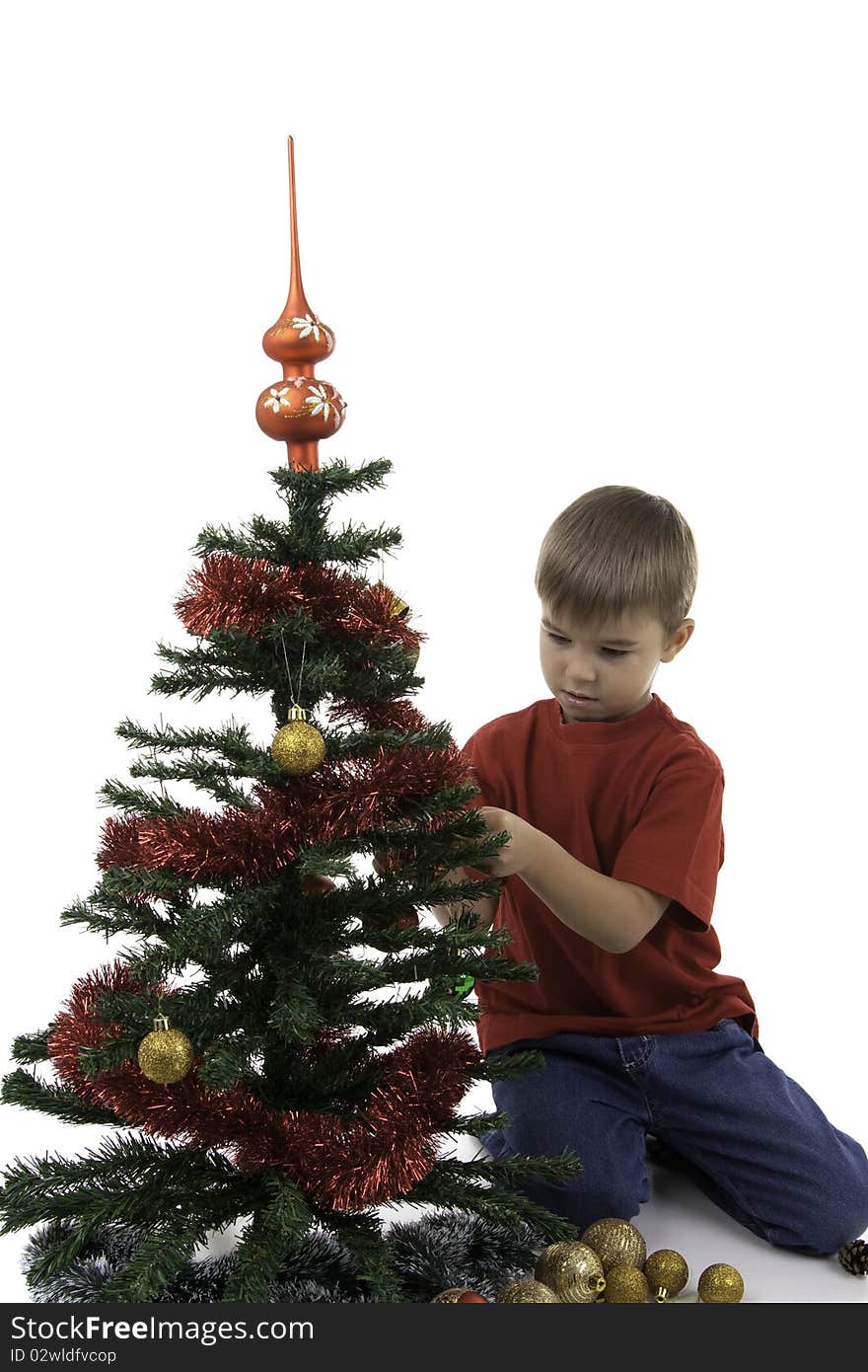 Boy decorate a New Year tree, isolated. Boy decorate a New Year tree, isolated