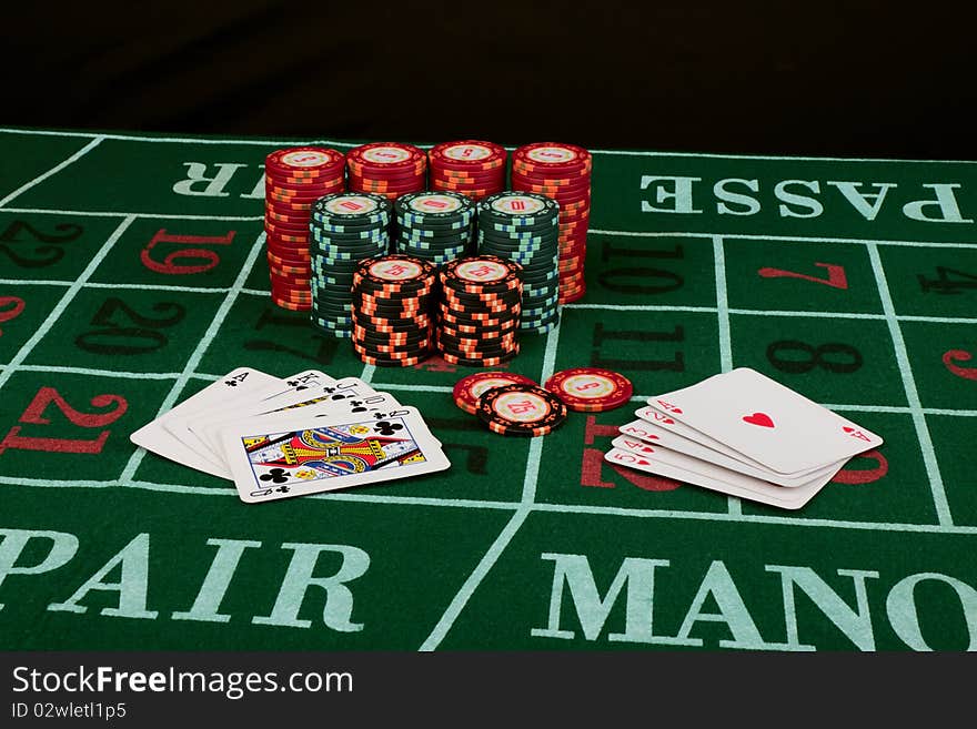 Casino card game showing chips on green cloth background. Casino card game showing chips on green cloth background