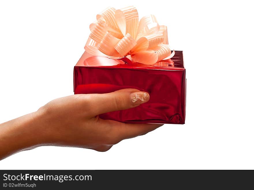 Woman's hand with a small red gift box isolated on white background. Woman's hand with a small red gift box isolated on white background