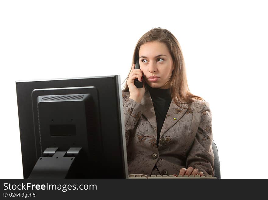 Businesswoman speak by phone sitting on her workplace. Businesswoman speak by phone sitting on her workplace