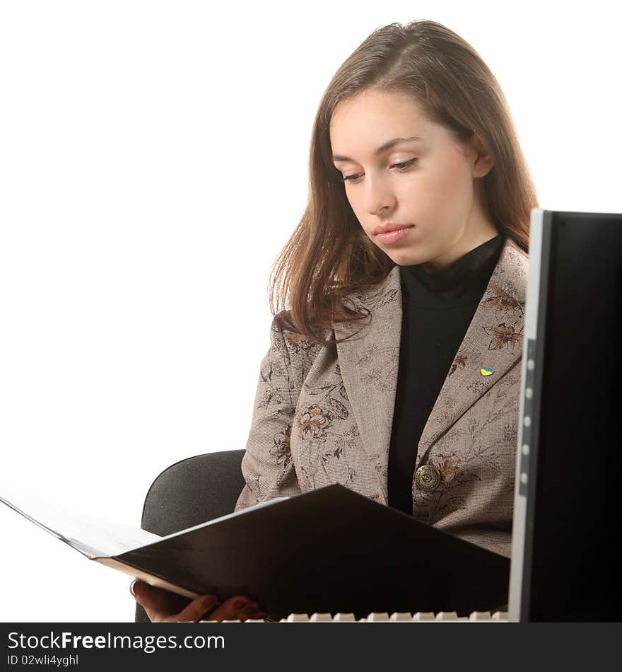 Businesswoman sit on the workplace and read a document. Businesswoman sit on the workplace and read a document