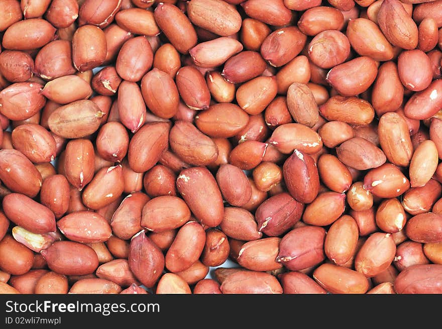 Closeup of red drying peanuts.