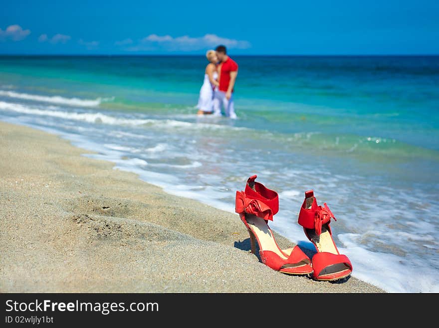 Young attractive couple at the beach kissing