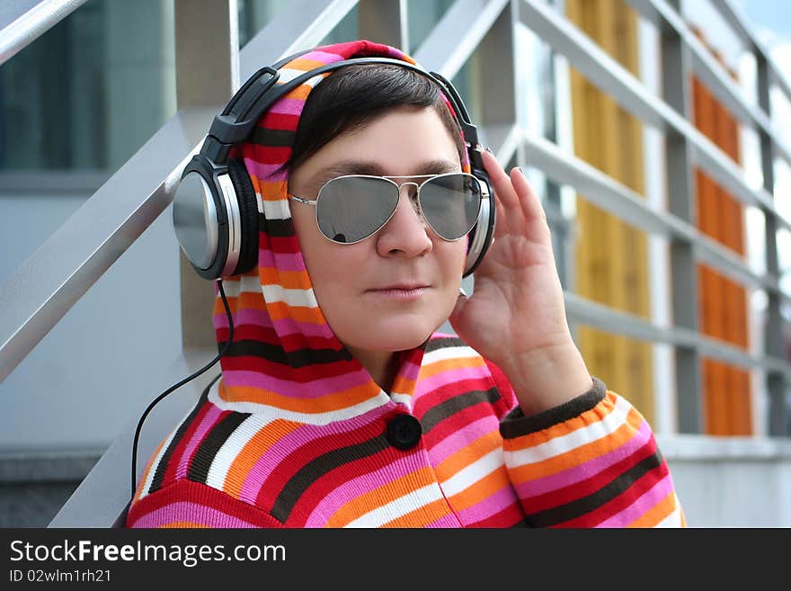 Attractive woman enjoying music outdoors. Attractive woman enjoying music outdoors