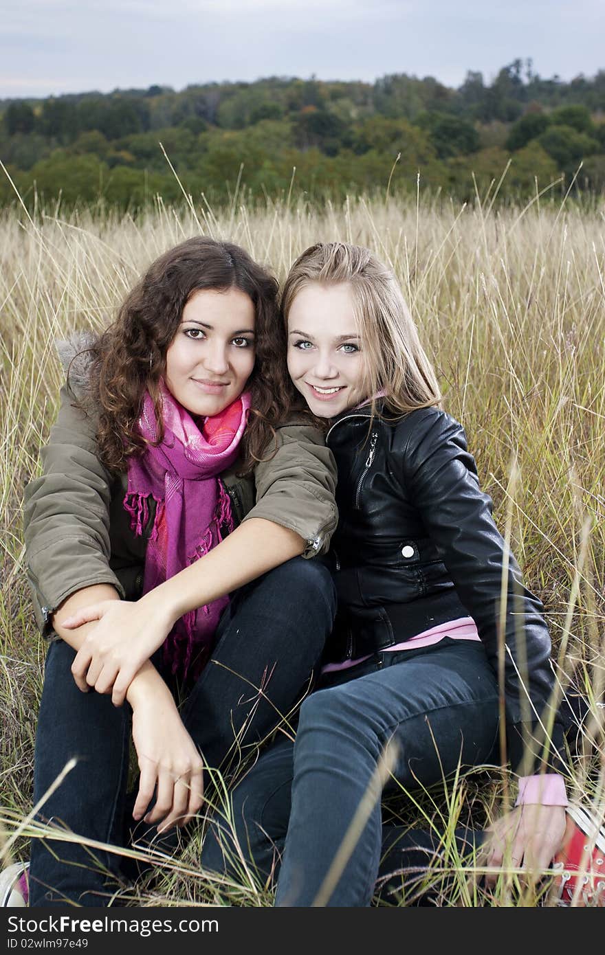 Twobeautiful young women on a beautiful autumn day. Twobeautiful young women on a beautiful autumn day