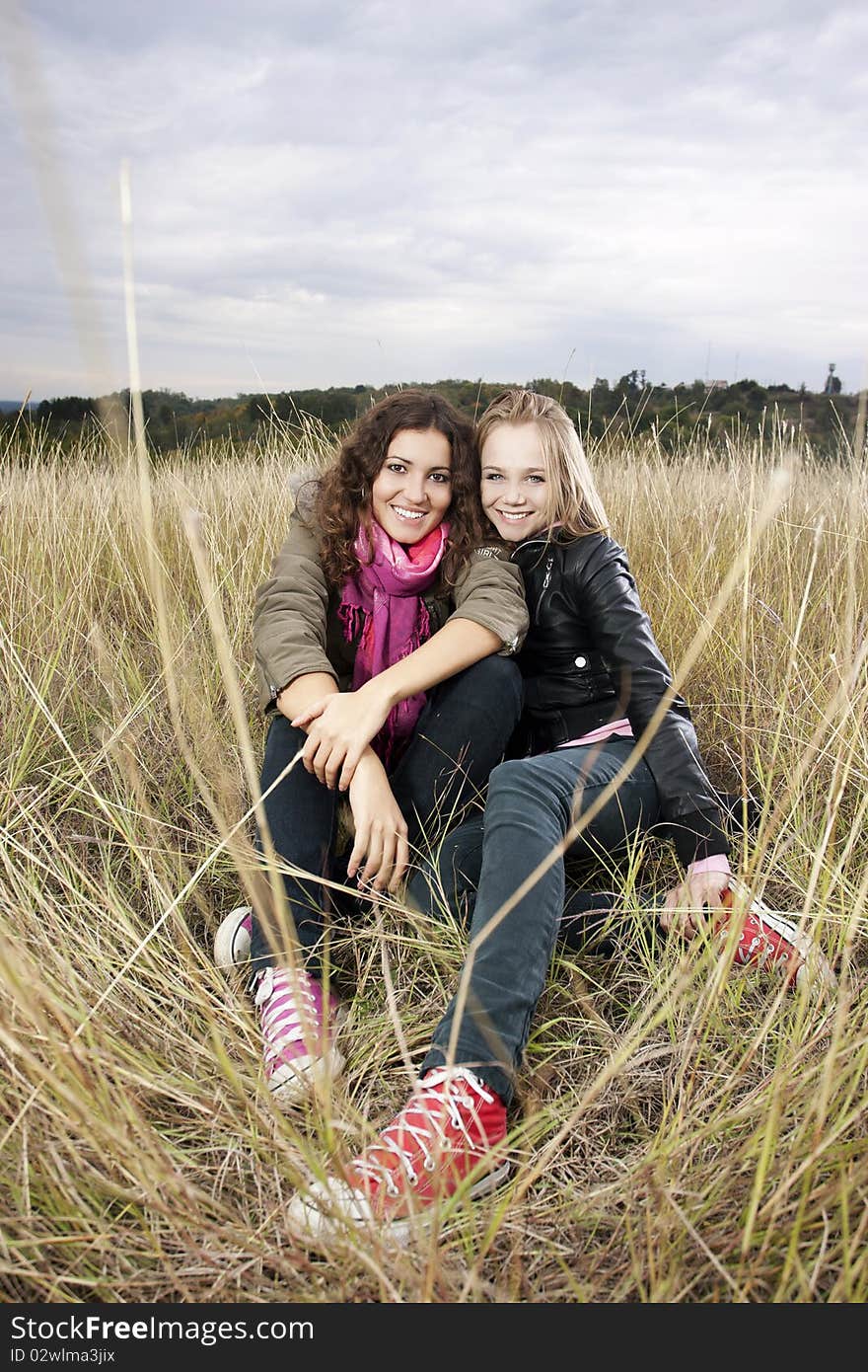 Twobeautiful young women on a beautiful autumn day. Twobeautiful young women on a beautiful autumn day