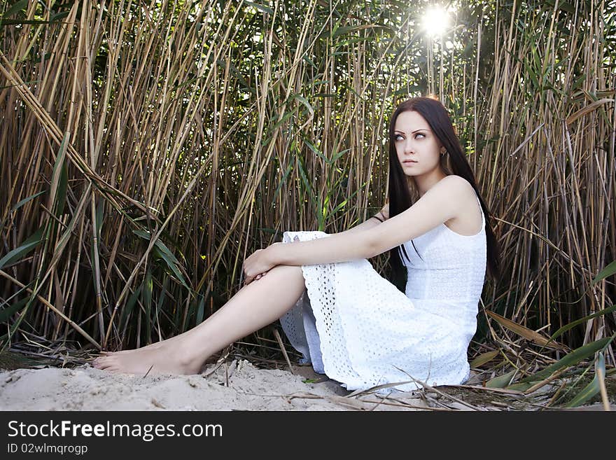 Beautiful woman in a white dress