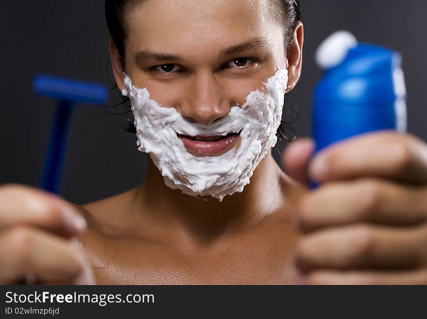 Handsome man shaving