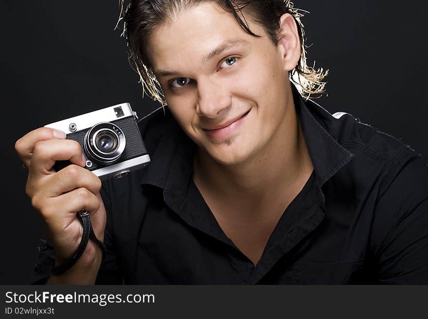 Man holding a photo camera. Man holding a photo camera