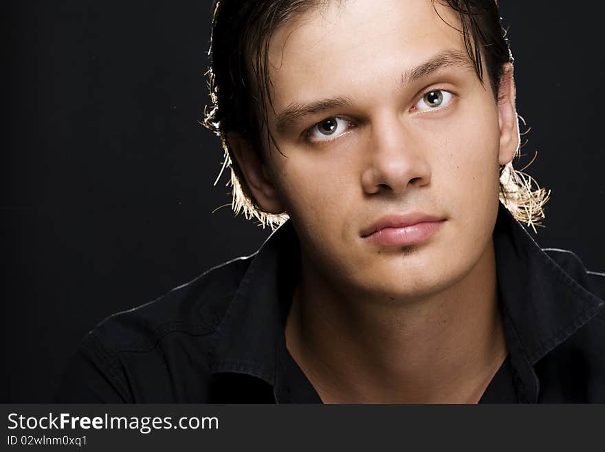 Portrait of young handsome man looking at camera. Portrait of young handsome man looking at camera