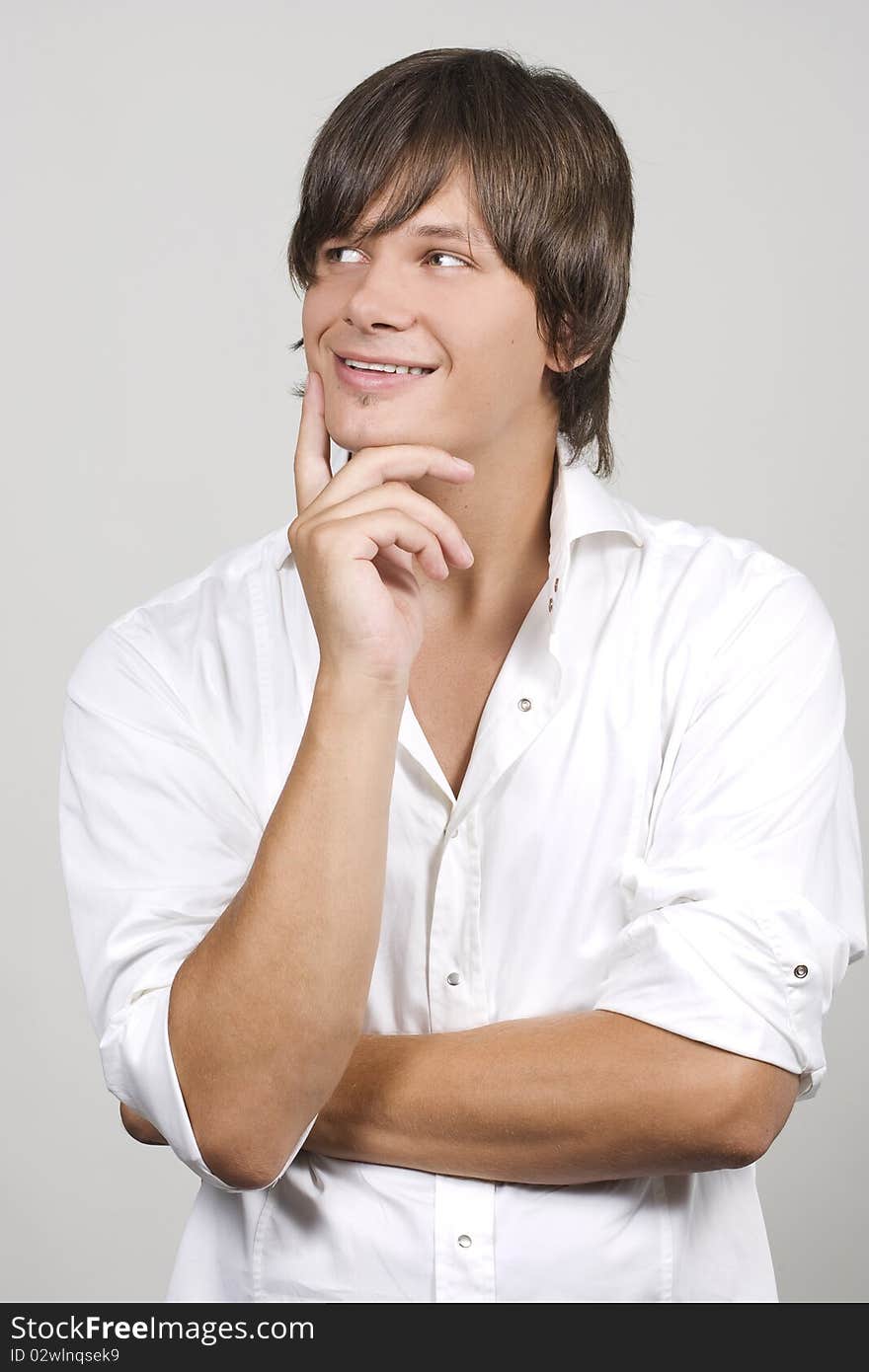 Closeup portrait of a charming young man smiling with copyspace. Closeup portrait of a charming young man smiling with copyspace