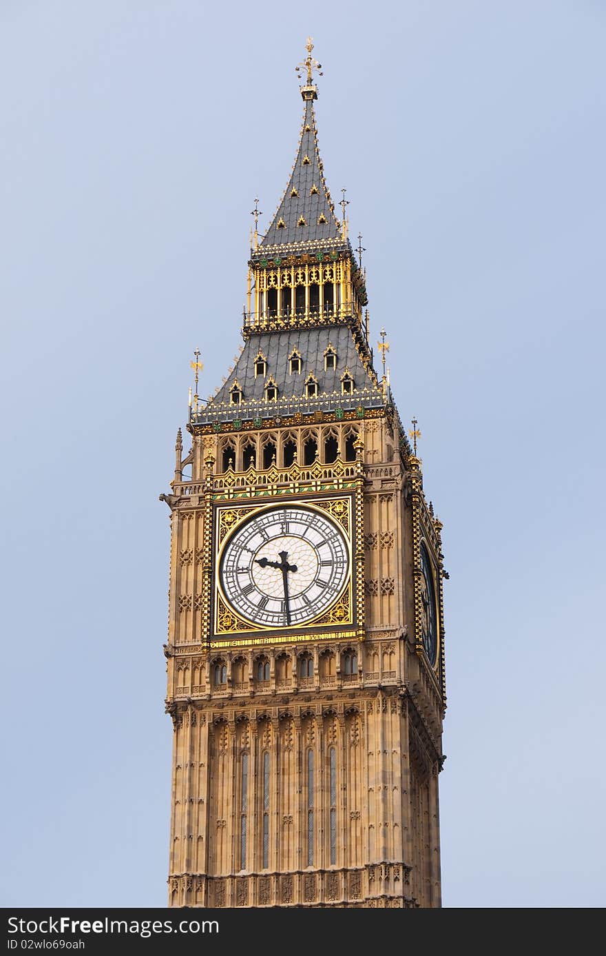 A close up of the Gothic Clock Face of Big Ben showing the gilded decorations reflecting in the sunlight. Houses of Parliament, London UK. A close up of the Gothic Clock Face of Big Ben showing the gilded decorations reflecting in the sunlight. Houses of Parliament, London UK.