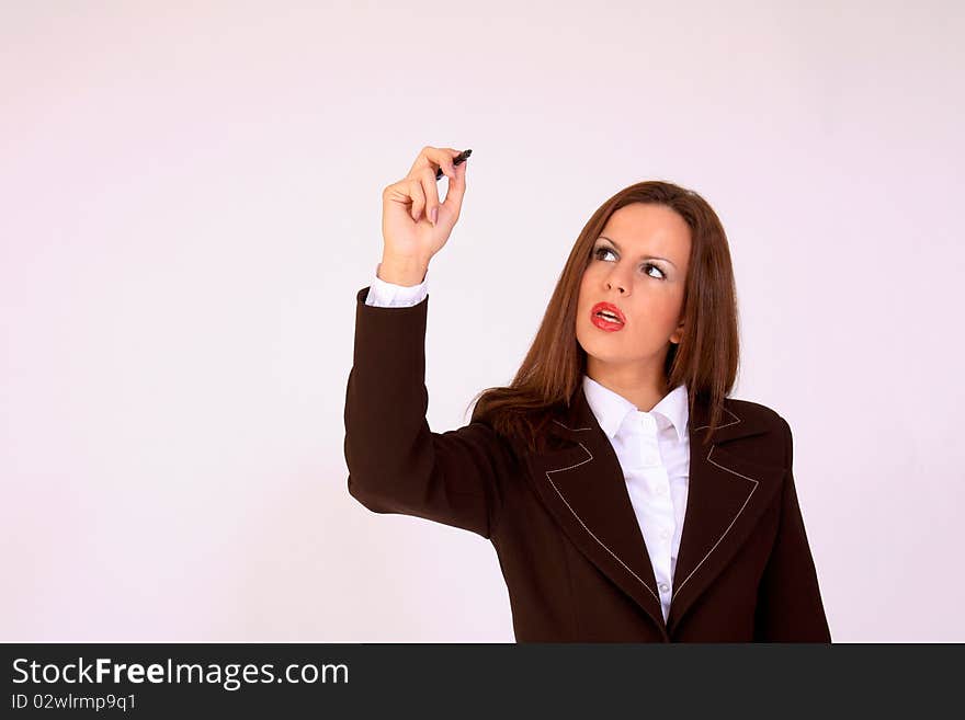 Attractive female holding a pen drawing a diagram