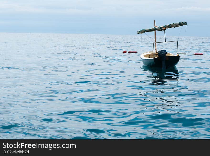 Old forgotten boat in water of Adriatic sea. Old forgotten boat in water of Adriatic sea