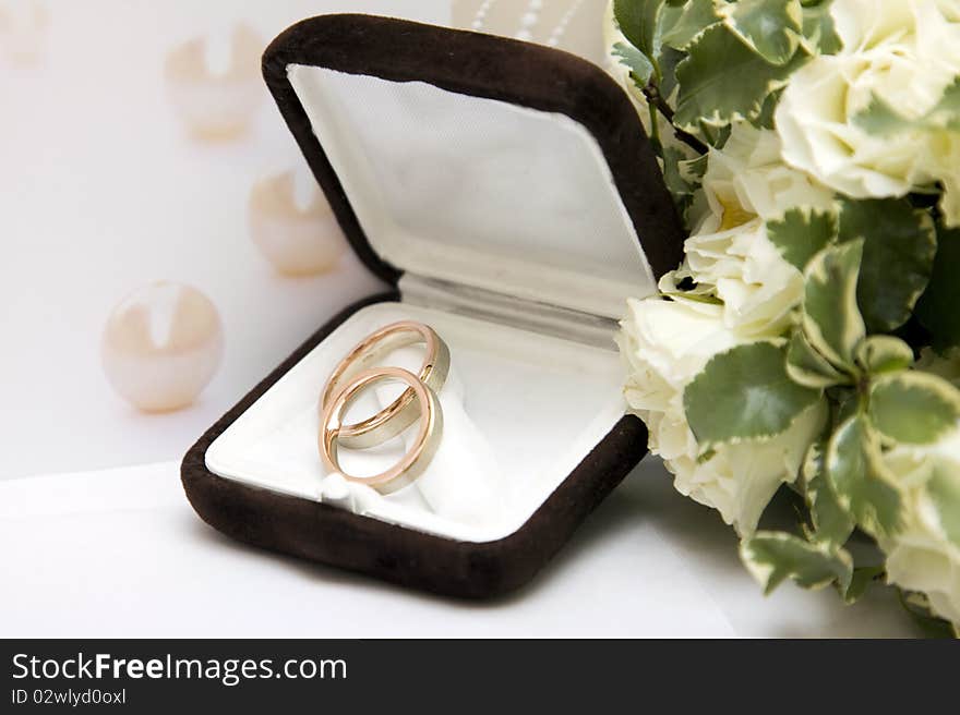 Wedding rings and bouquet