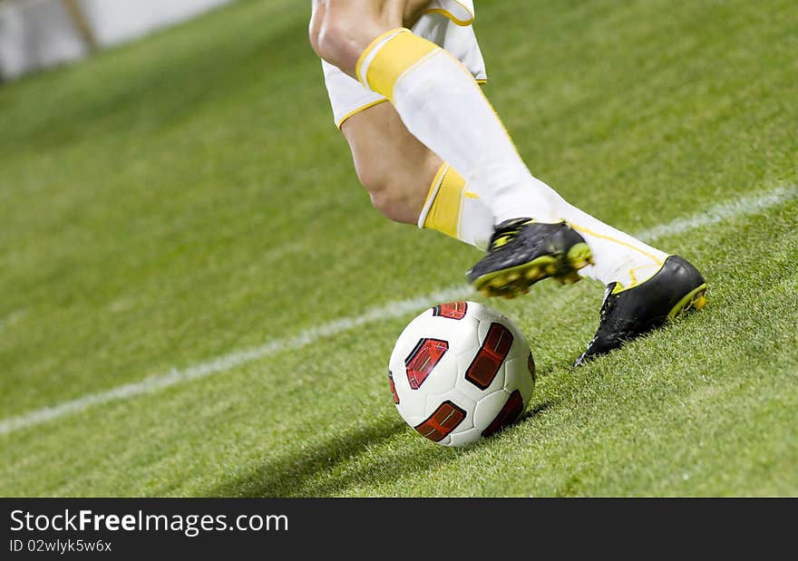 Soccer player running after the ball