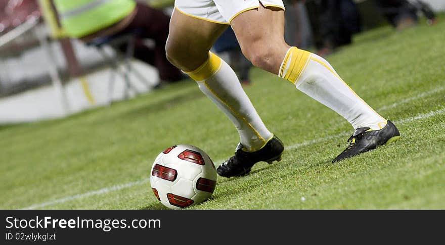 Soccer player running after the ball