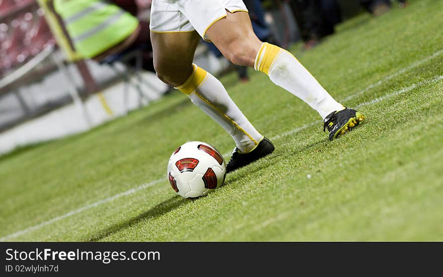 Soccer player running after the ball