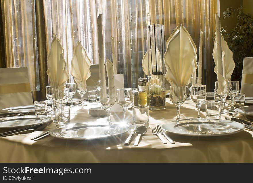 Festive table setting in front of window