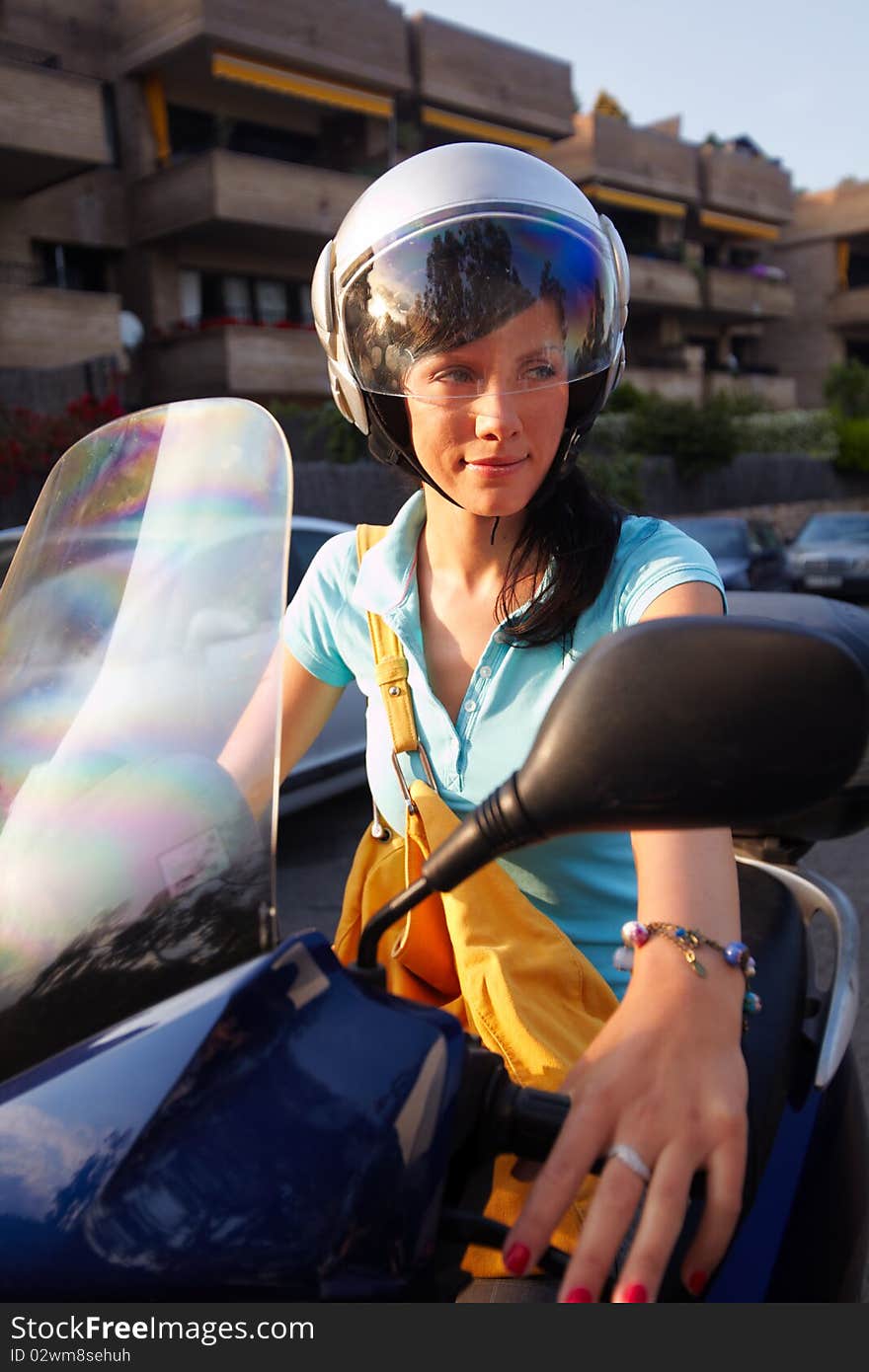 Young caucasian woman is driving a bike. Young caucasian woman is driving a bike