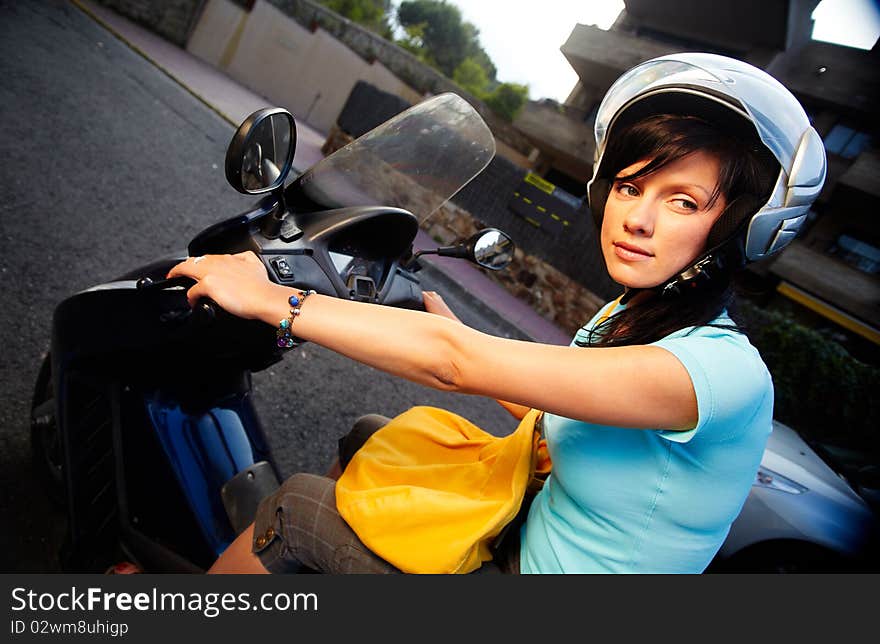 Young caucasian woman is driving a bike. Young caucasian woman is driving a bike