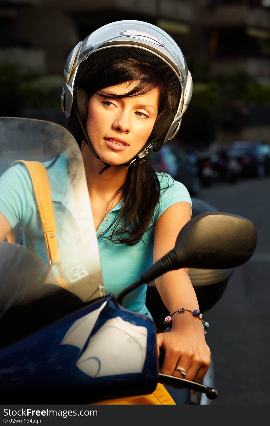 Young caucasian woman is driving a bike. Young caucasian woman is driving a bike