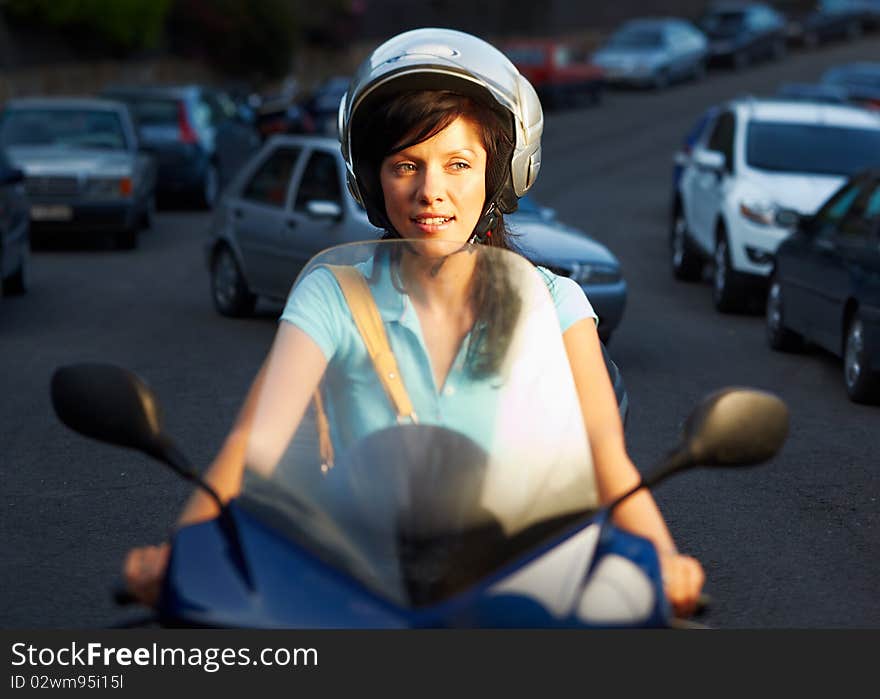 Young caucasian woman is driving a bike. Young caucasian woman is driving a bike