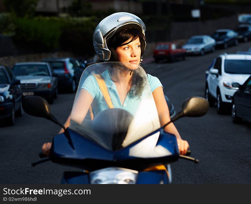 Young caucasian woman is driving a bike. Young caucasian woman is driving a bike