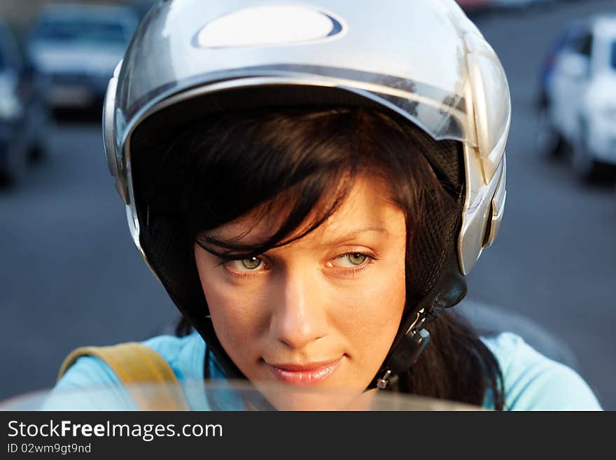 Young caucasian woman is driving a bike. Young caucasian woman is driving a bike