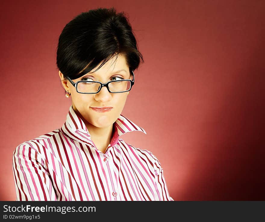 Nerdy office woman over bordeaux background looking ecstatic. Nerdy office woman over bordeaux background looking ecstatic