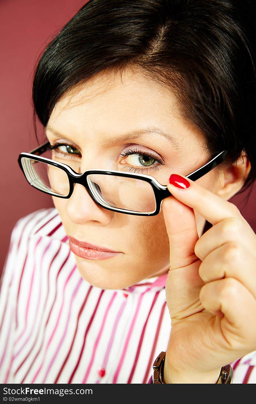 Nerdy office woman over bordeaux background looking ecstatic. Nerdy office woman over bordeaux background looking ecstatic