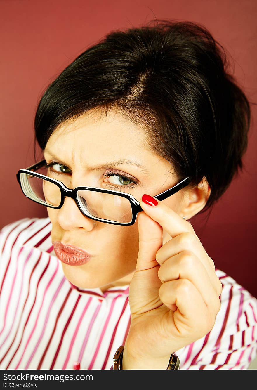 Nerdy office woman over bordeaux background looking ecstatic. Nerdy office woman over bordeaux background looking ecstatic