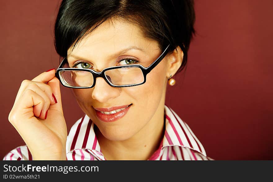 Nerdy office woman over bordeaux background looking ecstatic. Nerdy office woman over bordeaux background looking ecstatic