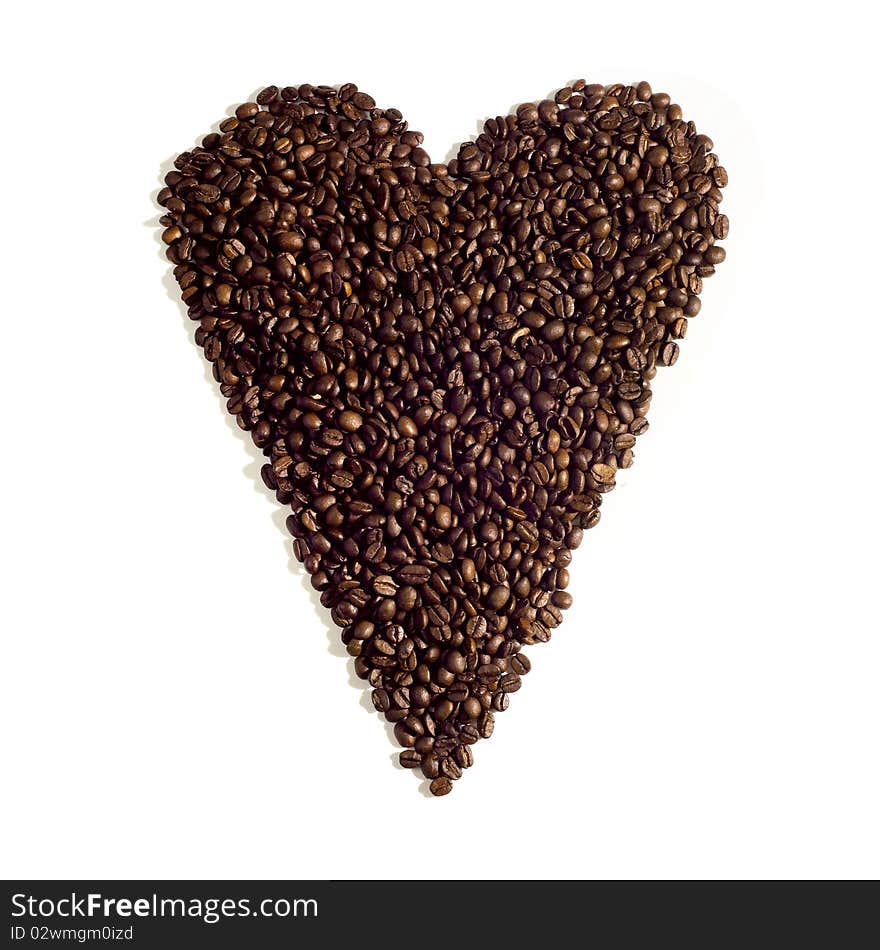 Heart sign made of coffee beans with uncommon lighting. Heart sign made of coffee beans with uncommon lighting