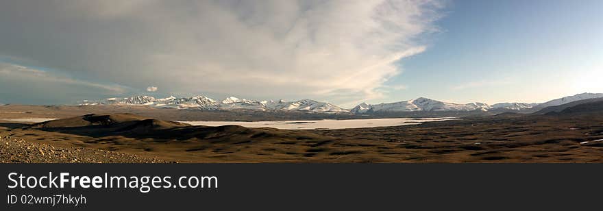 Panorama on snow mountains and blue lake. Mongolia. Panorama on snow mountains and blue lake. Mongolia