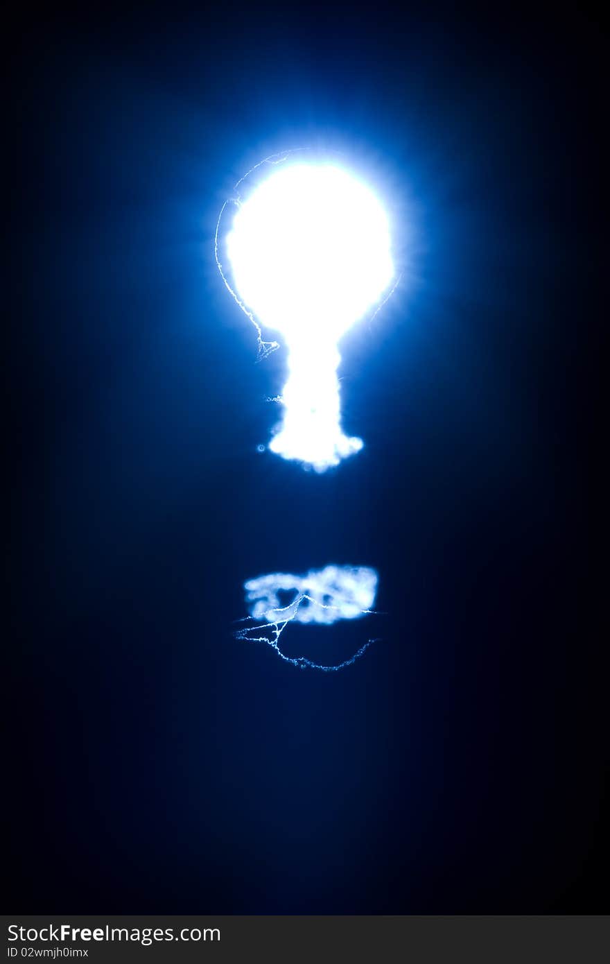 Light shining blue through a keyhole