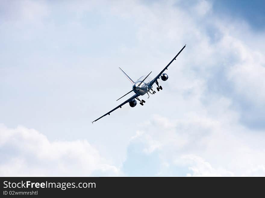 Airplane on a cloudy sky