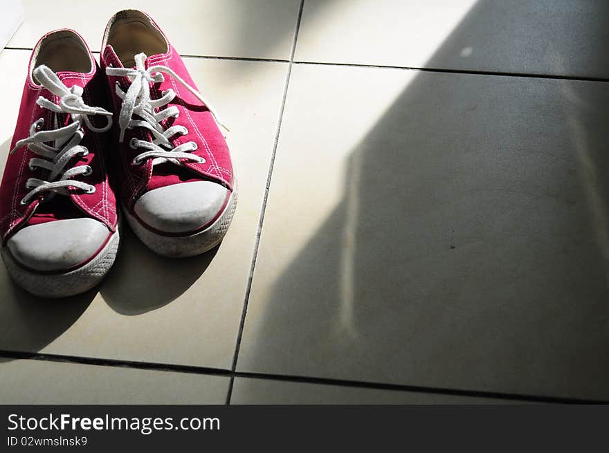 A photo of a red sneaker. A photo of a red sneaker.