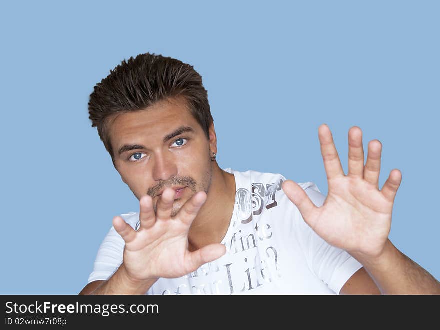 Portrait of guy against blue background