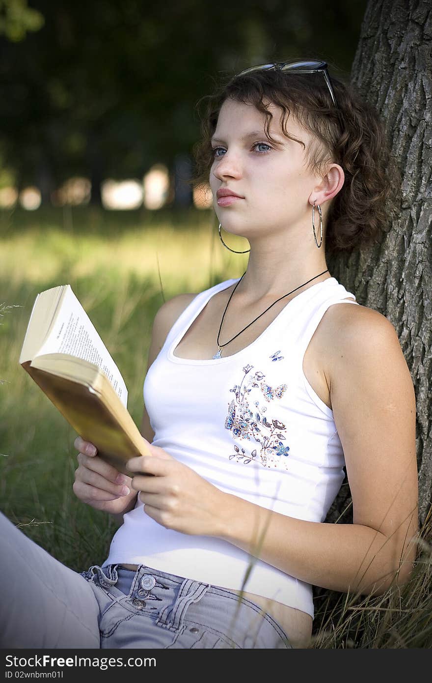 Girls Reading Book Outdoors