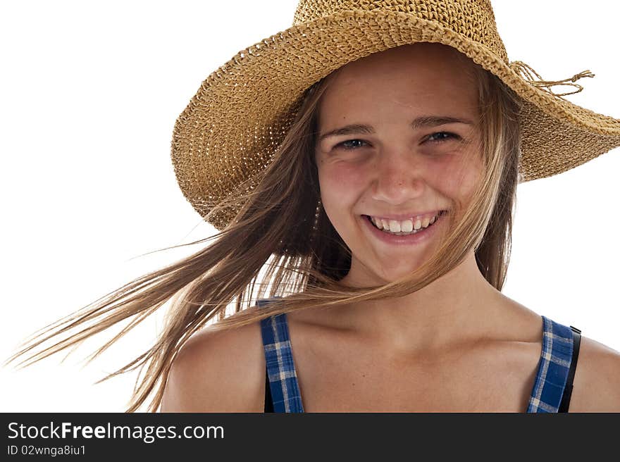 Pretty teen girl wearing an old straw hat. Pretty teen girl wearing an old straw hat