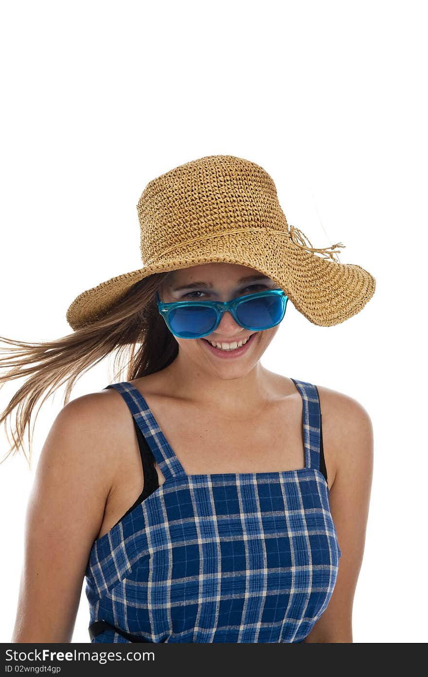 Pretty teen girl in blue sunglasses and a straw hat. Pretty teen girl in blue sunglasses and a straw hat