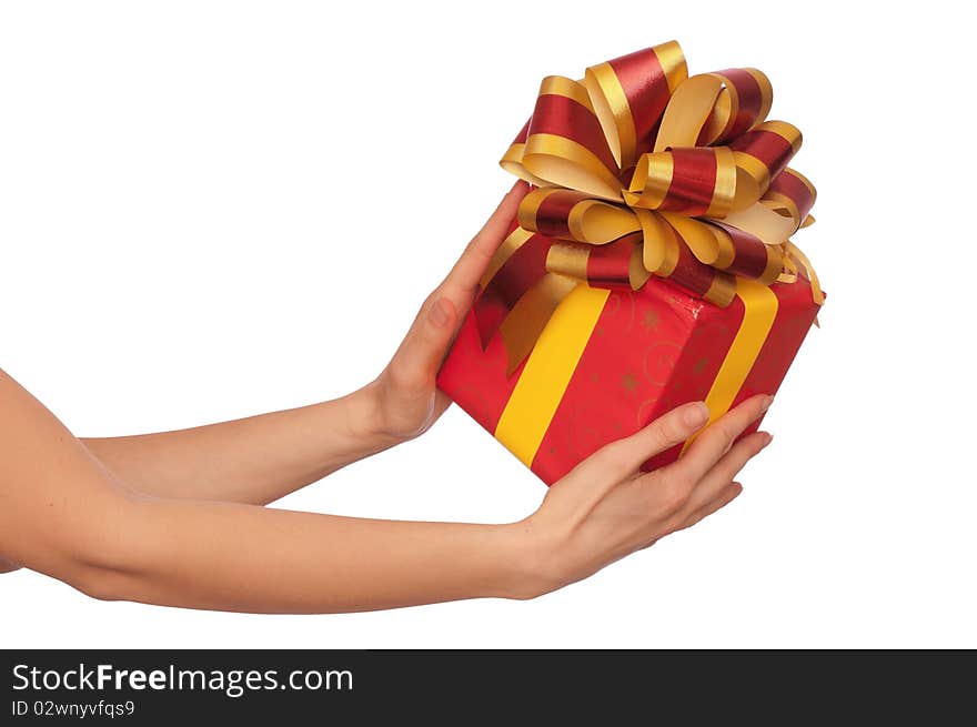 Woman giving a red box with yellow and red bow as a gift. Woman giving a red box with yellow and red bow as a gift