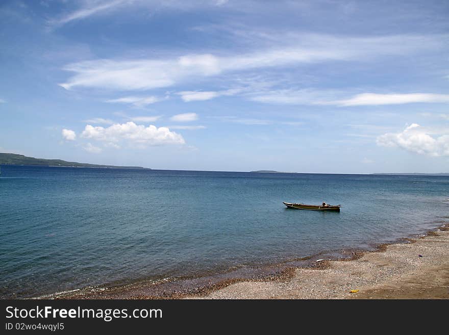 A rowboat in a very peaceful beach, at Buton Island, Southeast Sulawesi, Indonesia