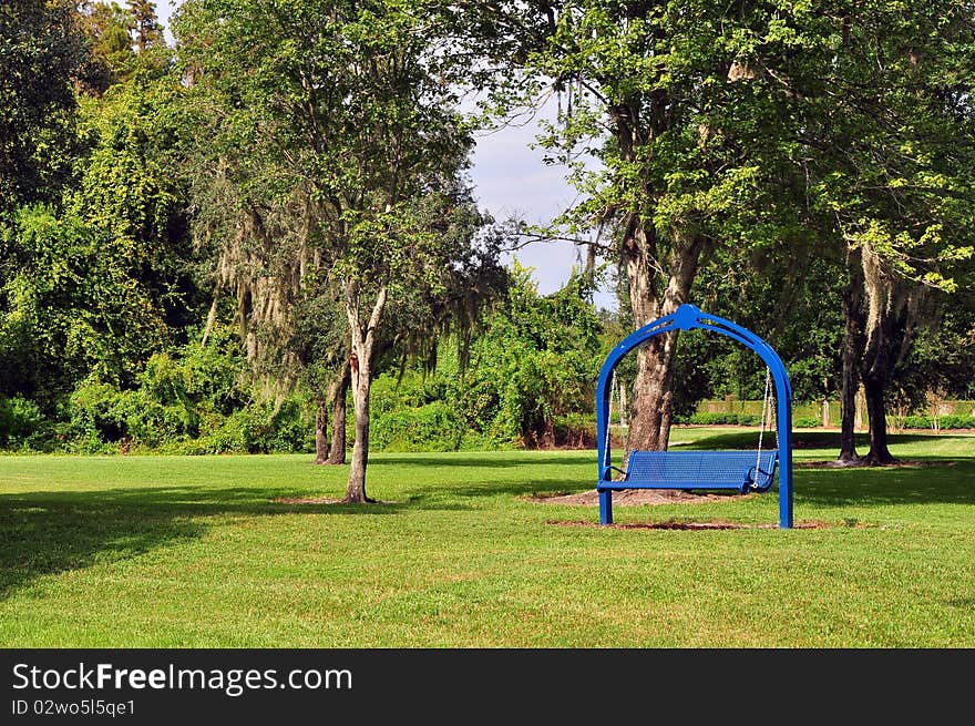 Blue rocking bench at a park