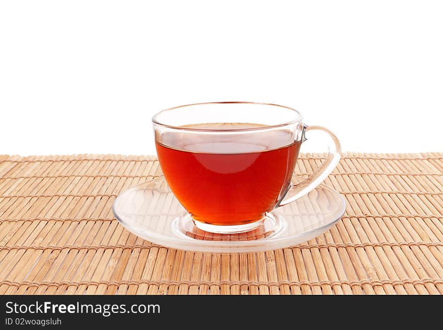 Series. Glass Cup of Tea on bamboo mat