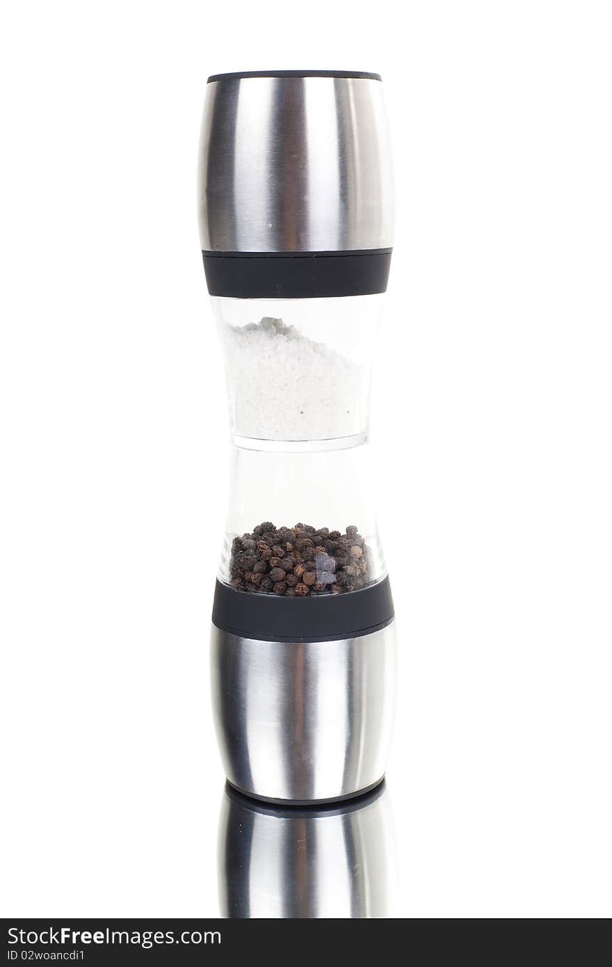 Series. A glass grinder of pepper isolated on a white background