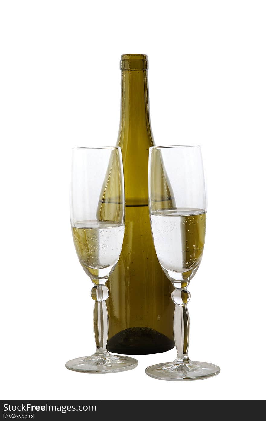 Two glasses with a liquid and a bottle on a white background. Two glasses with a liquid and a bottle on a white background