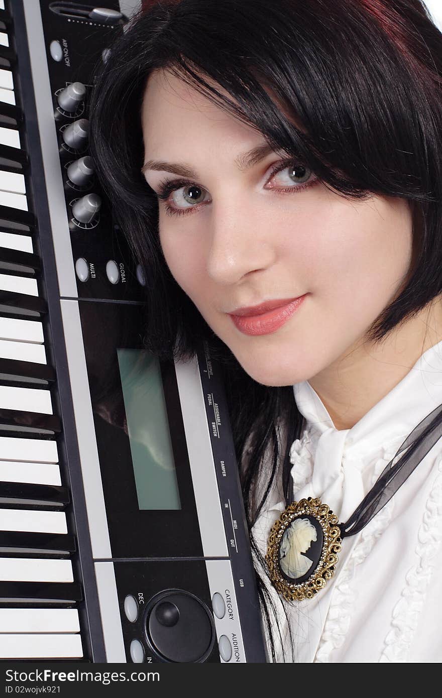 Beautiful girl with synthesizer isolated